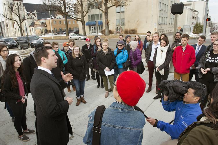 State Sen. Adam Morfeld of Lincoln speaks with students