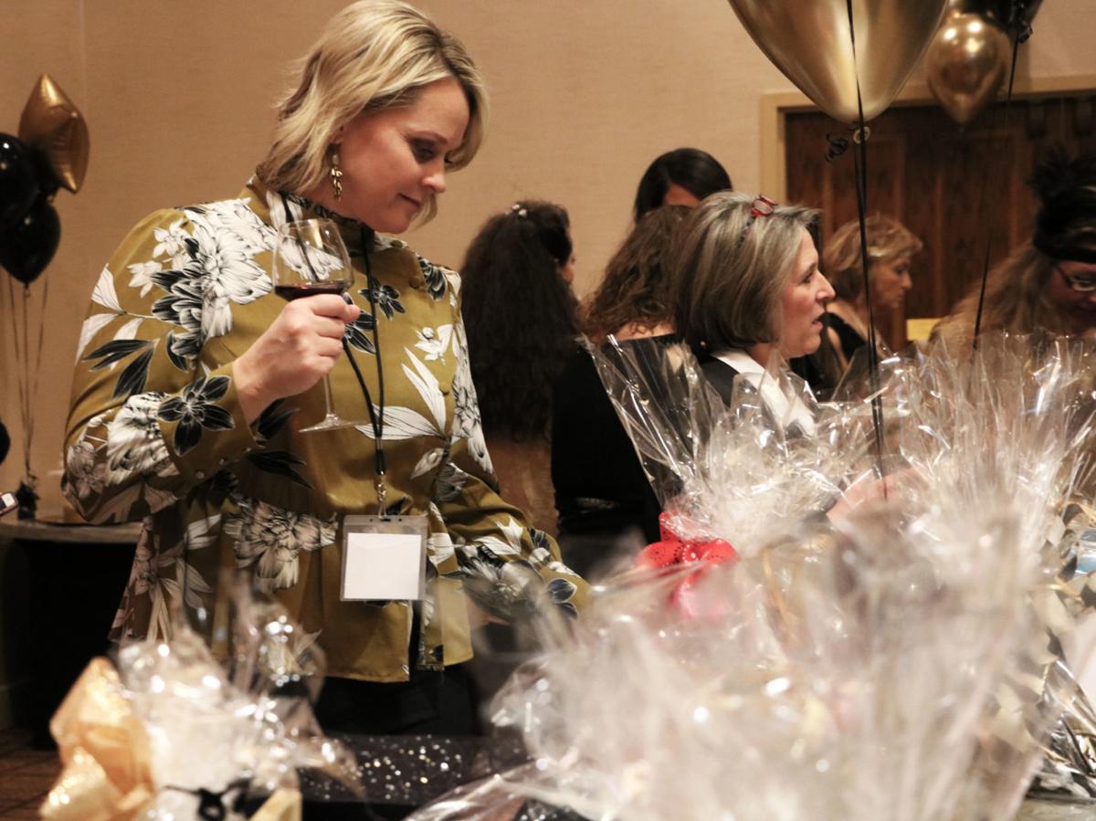 Amanda Dickson peruses auction items