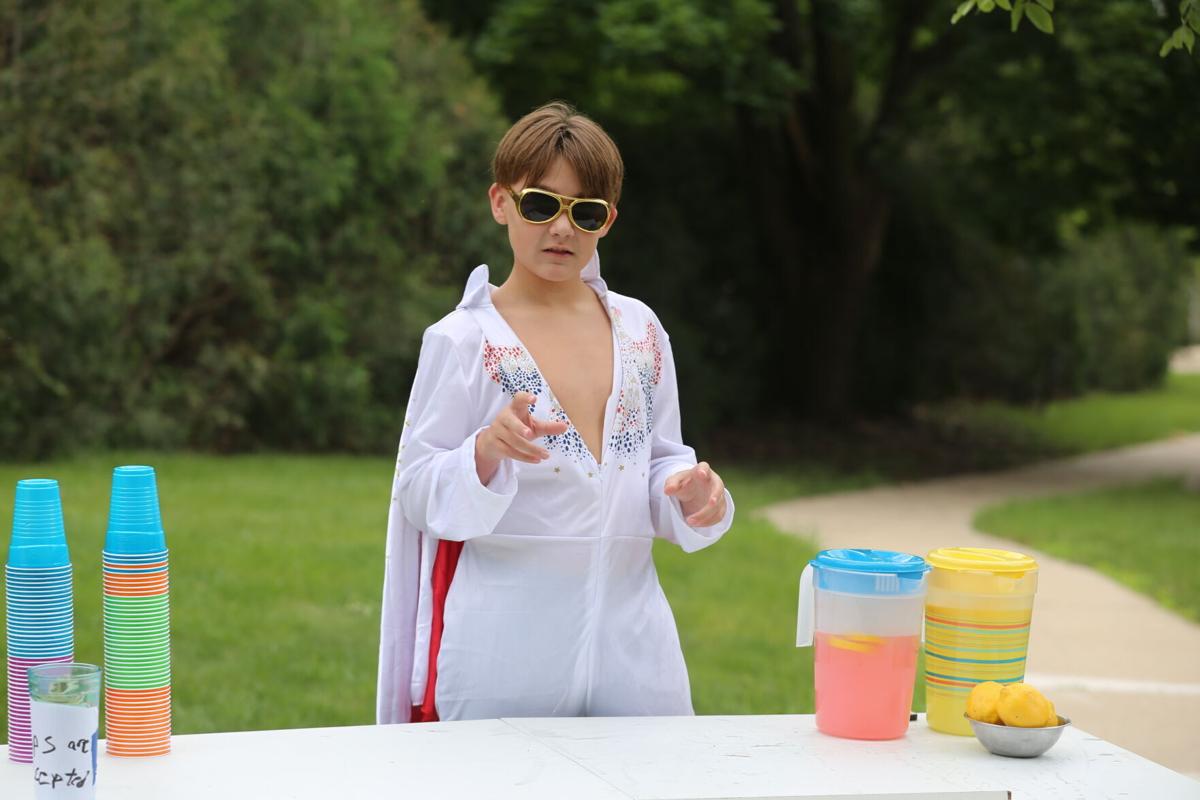 Xander Cox selling lemonade dressed as Elvis