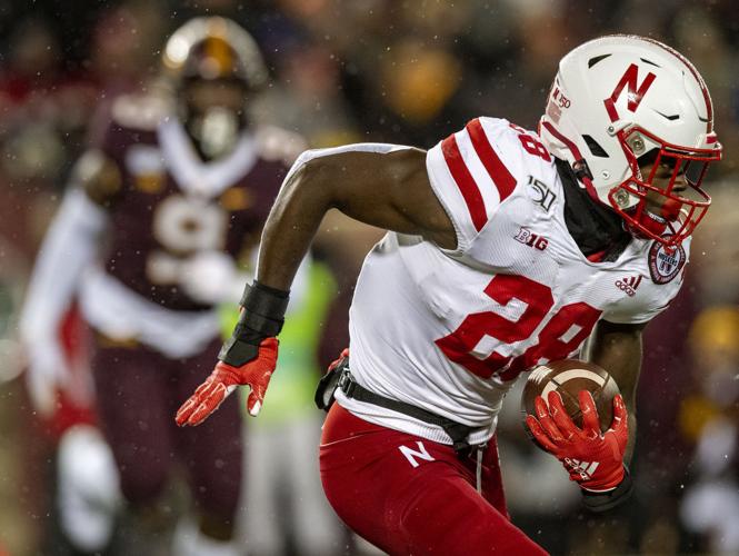 Lincoln, NE. U.S. 20th Oct, 2018. Minnesota Golden Gophers defensive  lineman Esezi Otomewo #9 reaches to tackle Nebraska Cornhuskers running  back Maurice Washington #28 in action during a NCAA Division 1 football