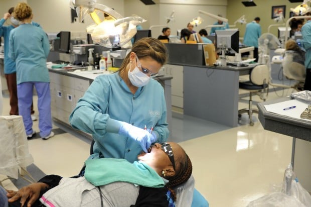 Students learn, patients find relief in free dental clinic ...