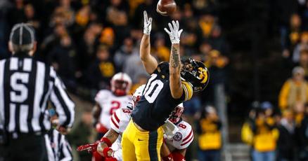 Four more members of Iowa football team charged in gambling scandal Four more members of Iowa football team charged in gambling scandal