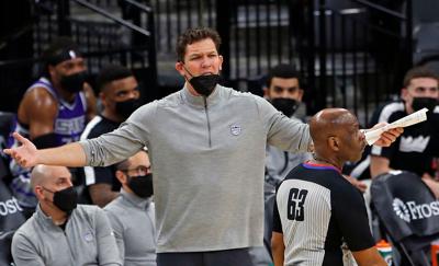 In this file photo, Sacramento Kings head coach Luke Walton complains about a call during action against the San Antonio Spurs at AT&T Center on March 29, 2021 in San Antonio, Texas.