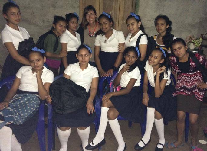 Julie Reager with Nicaraguan girls in uniforms