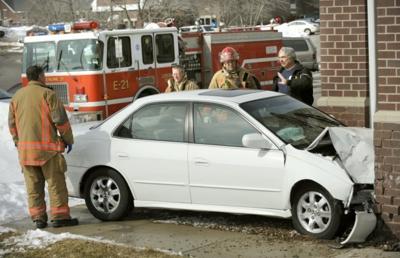 Car crashes into building near 56th and Old Cheney
