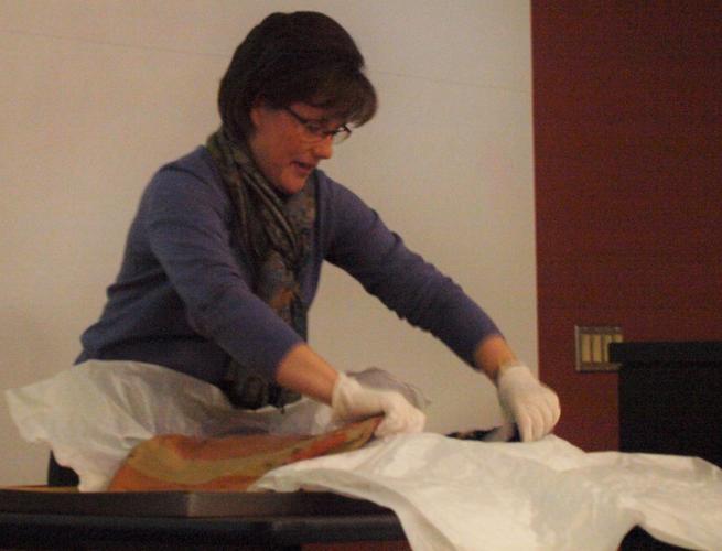 Sabrina Riley unfolds the Gettysburg flag
