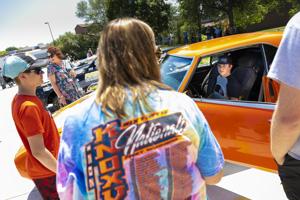 Racecars drive to Madonna Rehab Hospital in support of 14-year-old fan
