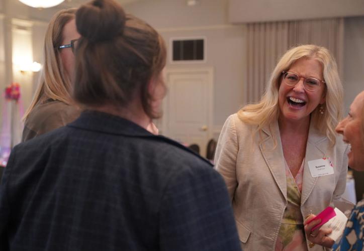 Suzanne Sughroue visits with guests