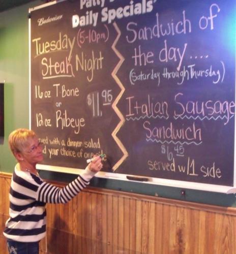 Sharon Gillispie updates specials board