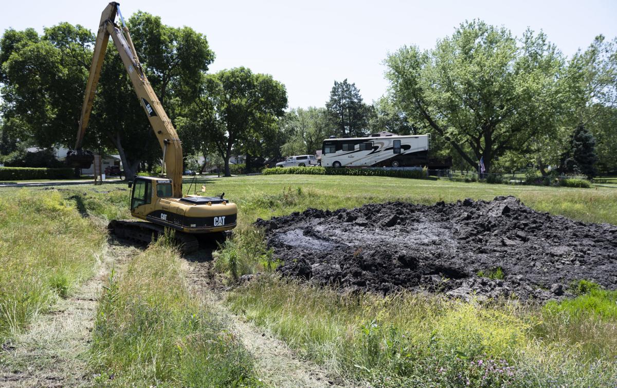 My Dogs Actually Gag City Working To Clean Up Stinky Trendwood Park Retention Pond Local Government Journalstar Com