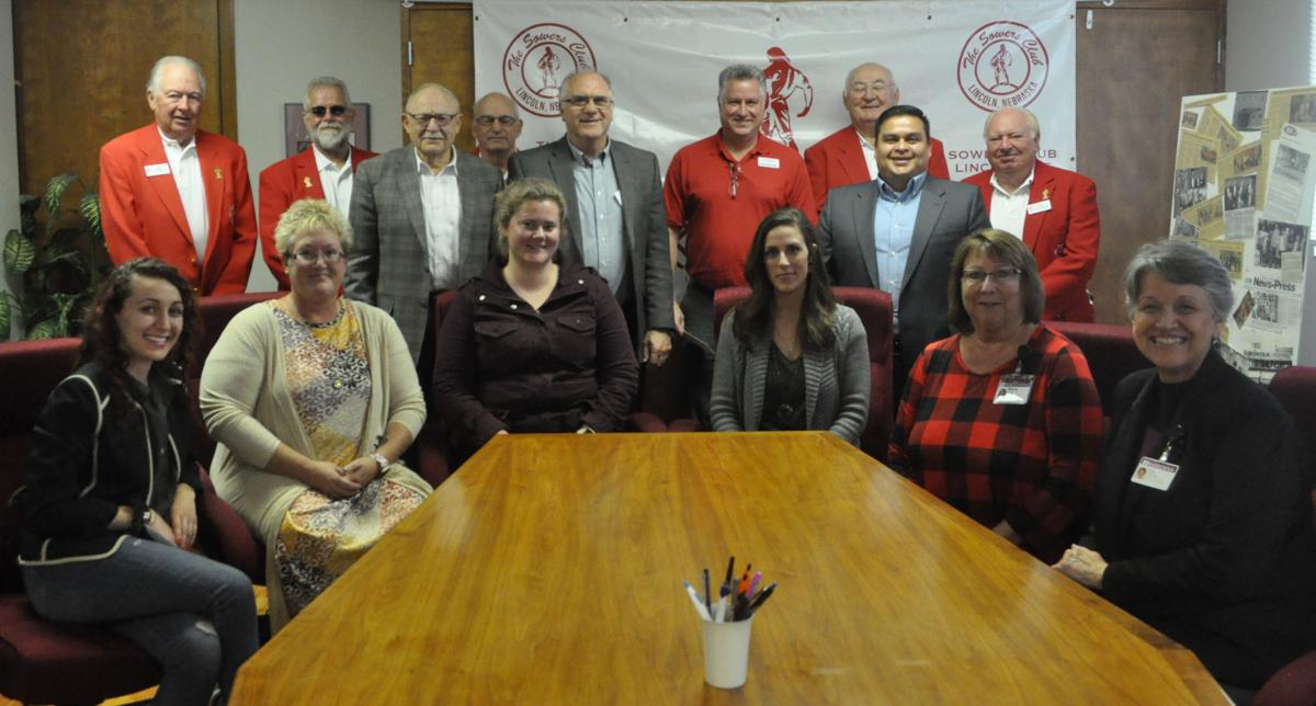 Sowers with nonprofit representatives