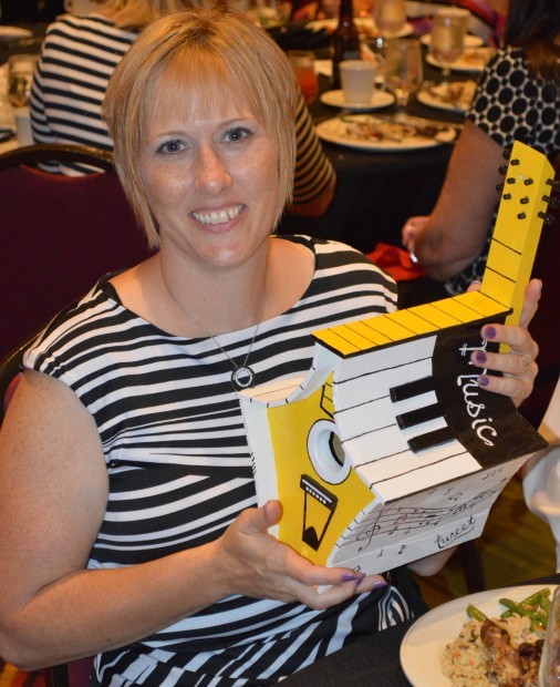 Michele Byrnes of Assurity Life with music themed birdhouse