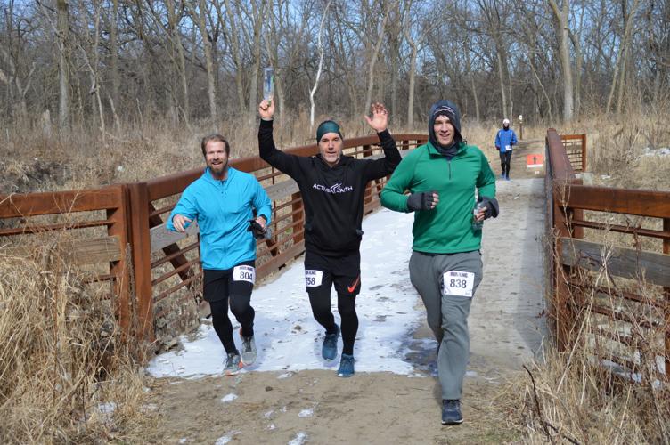 Aksel Nelsen, Bo Bryson and Sean Swihart cross bridge