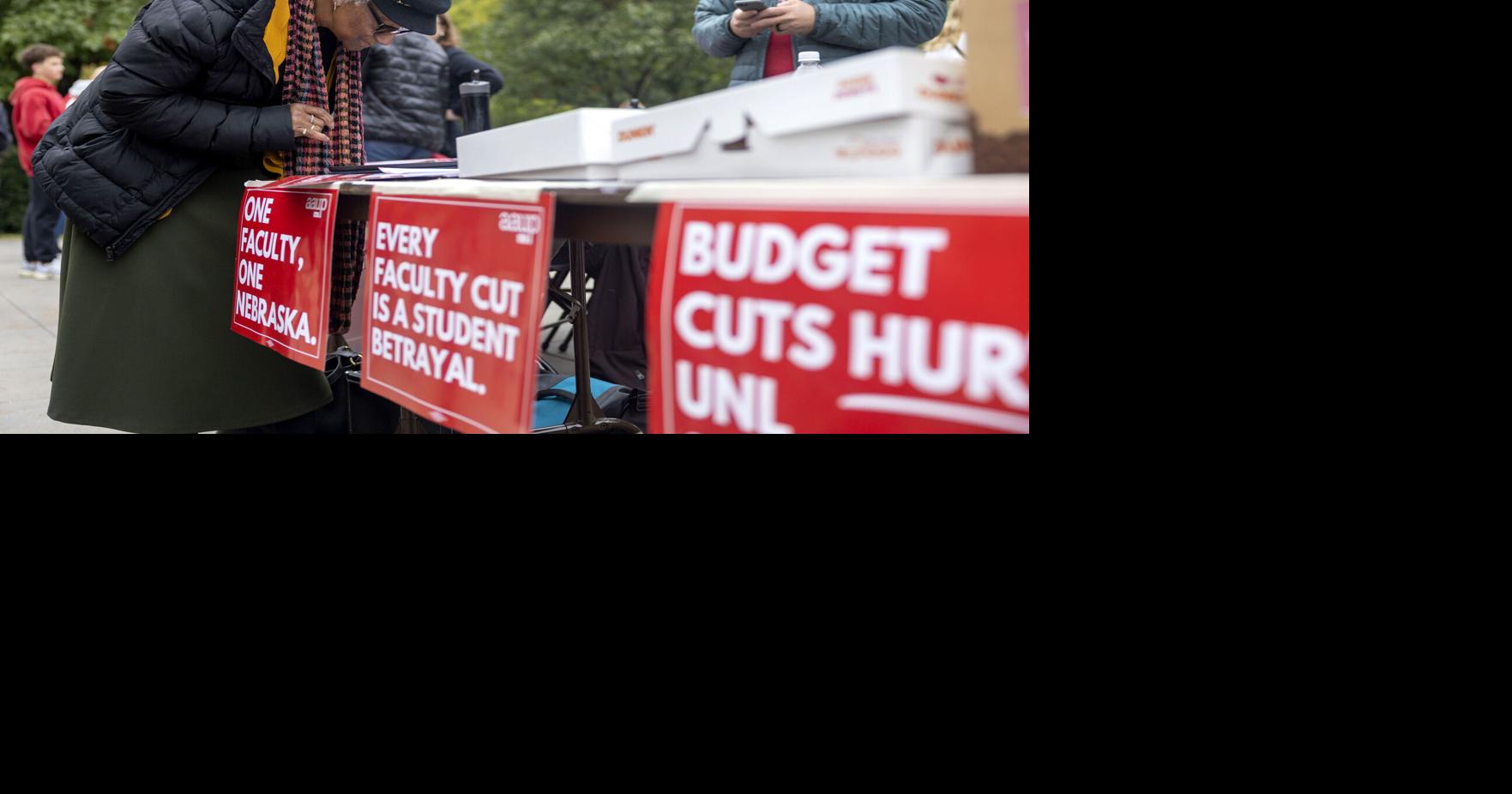 Advocates protest budget cuts as football fans make way to Memorial Stadium