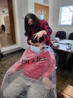 Vanessa Helbling gives a haircut