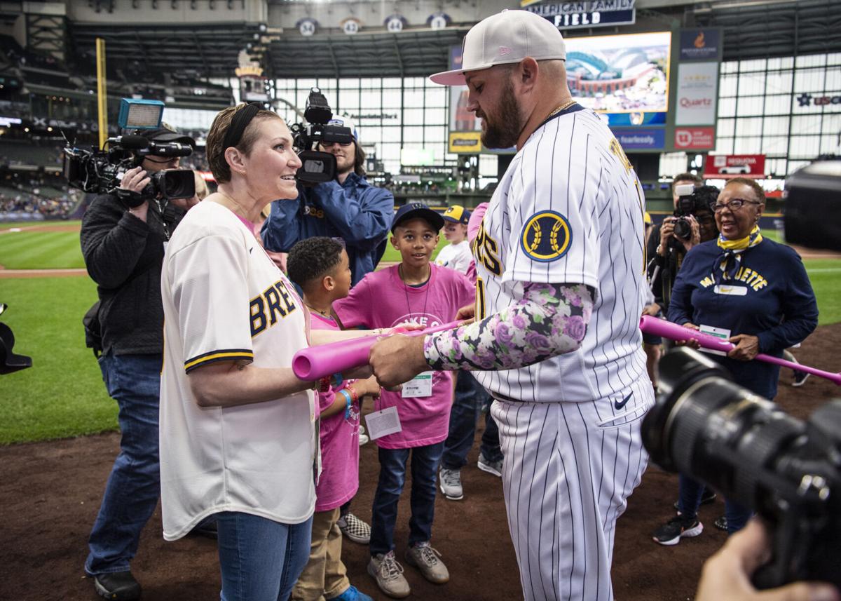 Racine mom, breast cancer survivor throws first pitch at Brewers