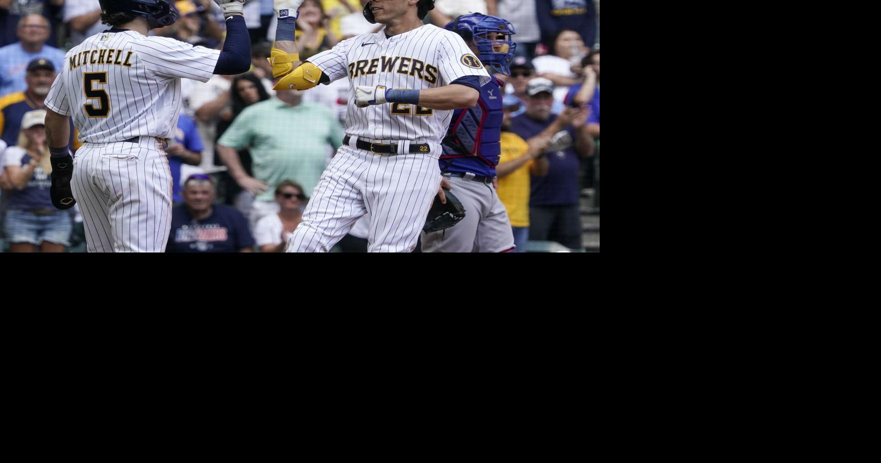 Milwaukee Brewers' Garrett Mitchell reacts after hitting a double