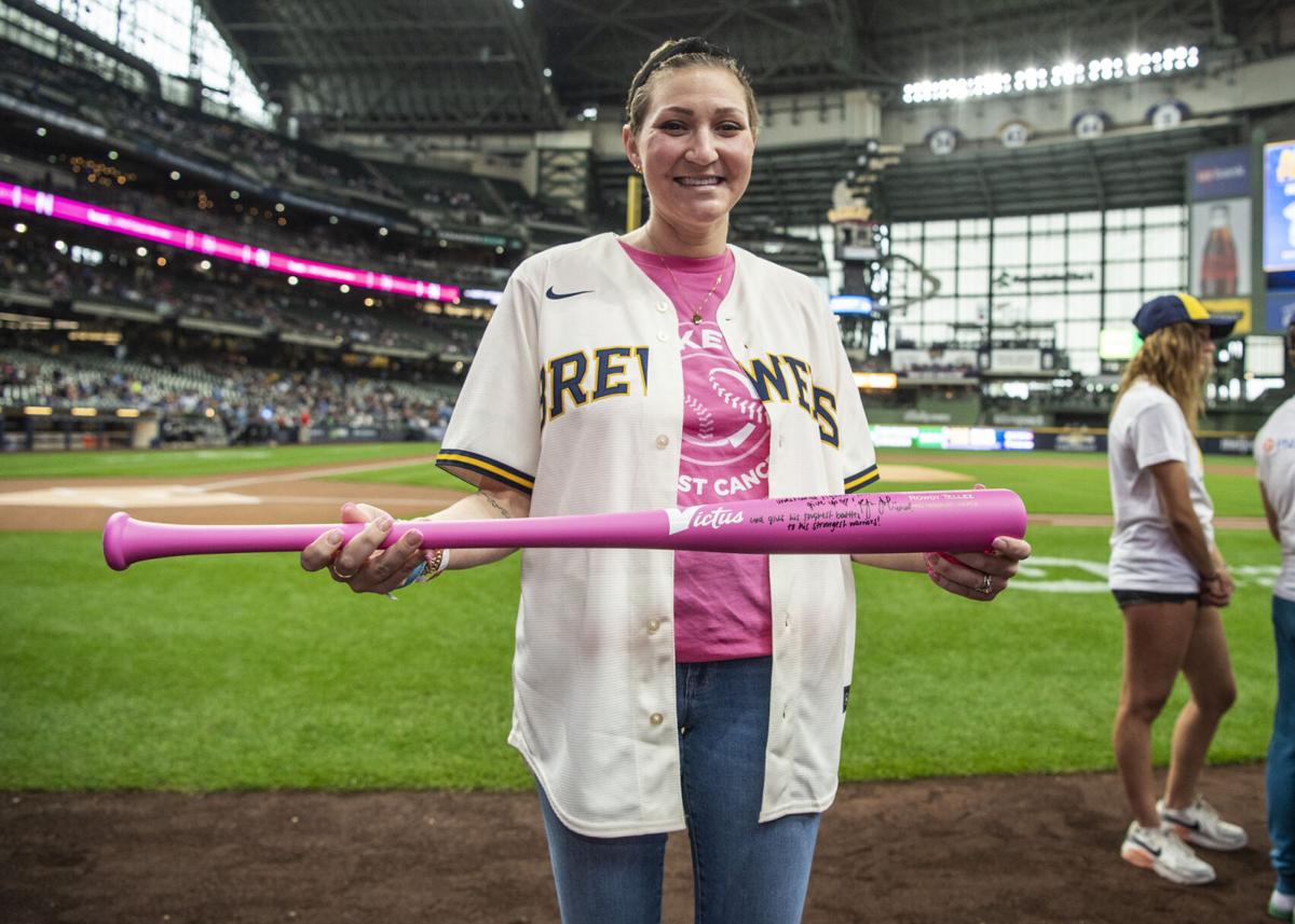 Racine mom, breast cancer survivor throws first pitch at Brewers