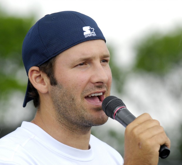 Candice Romo, wife of Dallas Cowboys quarterback Tony Romo, hands out  headbands she had bought for the girls registered during Romo' annual  football fundamentals camp at Burlington High School, Wednesday June 22