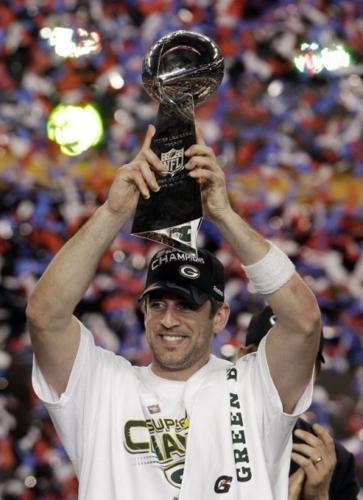 Aaron Rodgers holding Super Bowl trophy