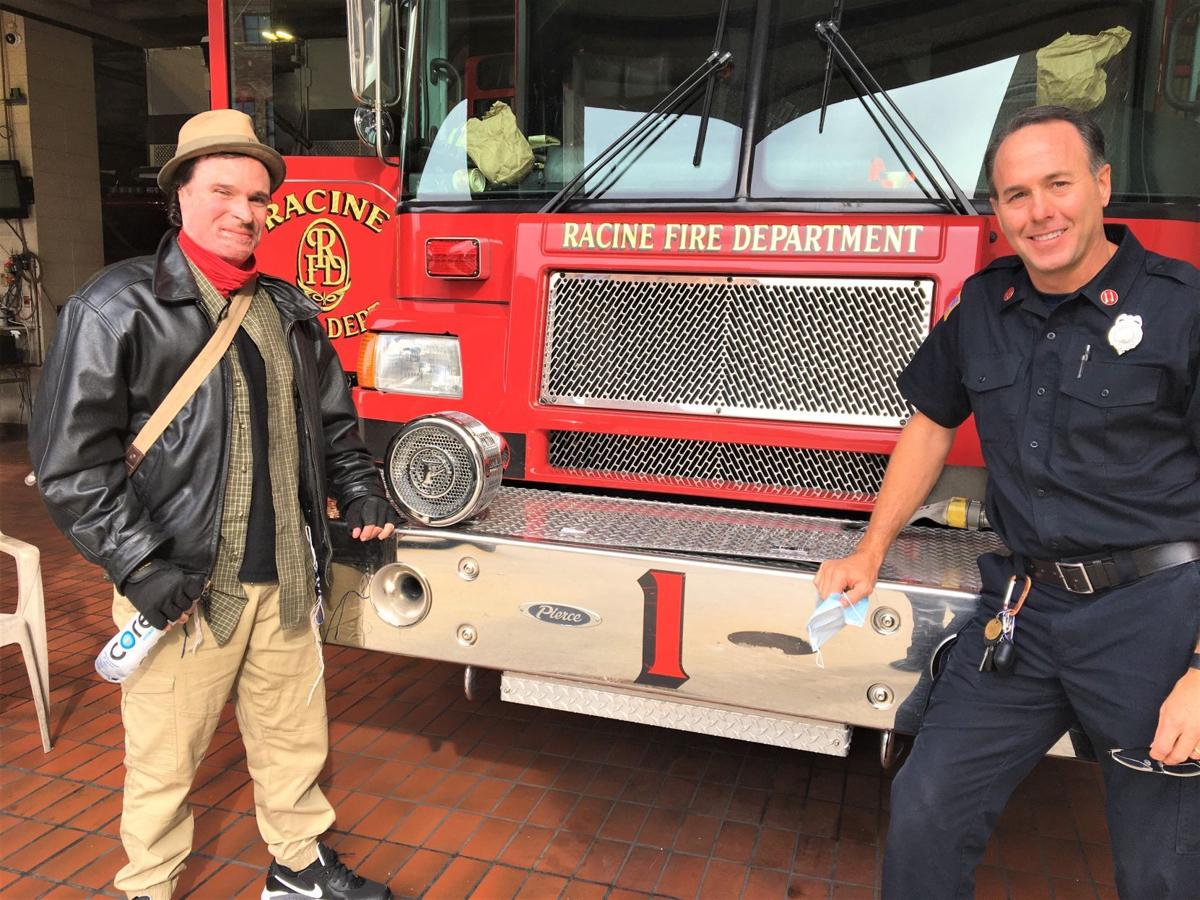 Fire survivor Joshua White and Capt. Craig Ford at Racine Fire Department Station 1