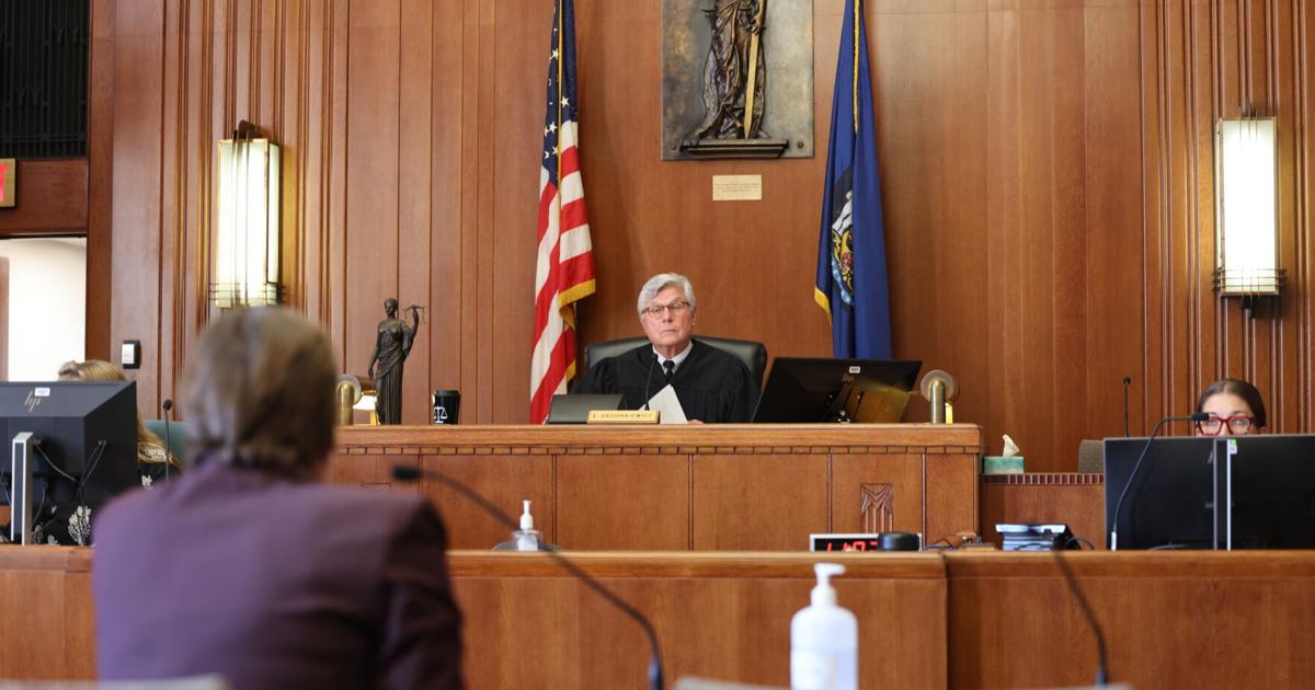 Twelve photos of Daniel Riedel and UGHS hearing