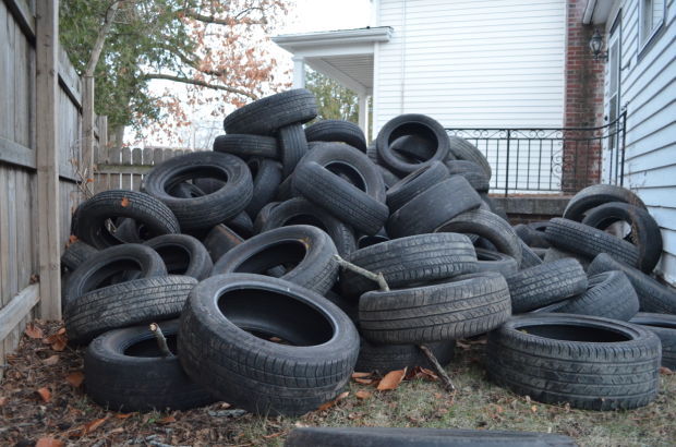 Property owner finds dozens of tires dumped on lawn