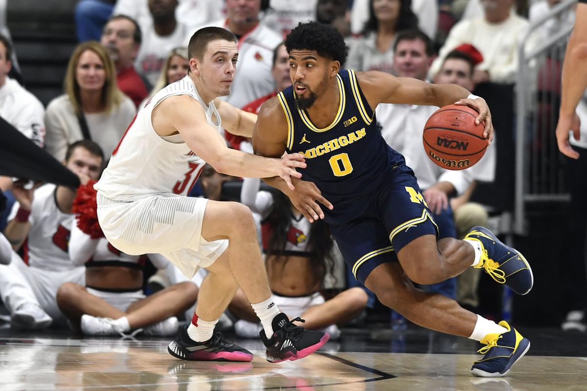 APTOPIX Michigan Louisville Basketball