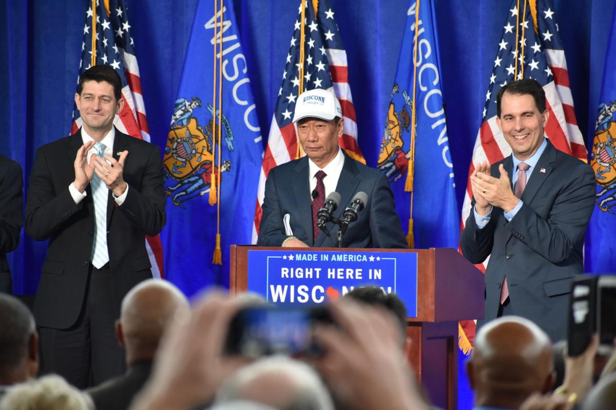Former House Speaker Paul Ryan, left, Foxconn chairman and CEO Terry Gou, and former Gov. Scott Walker celebrate an agreement with Foxconn in November 2017. Ricardo Torres, Racine Journal Times.