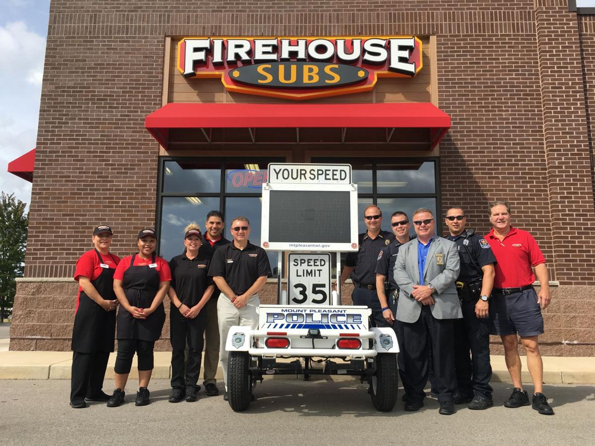 Firehouse subs deliver near $21,000 grant to police department | Local News | journaltimes.com