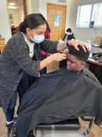 Courtney Krekling gives a haircut
