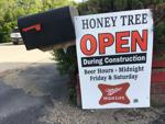 Hunny Tree Mini-Mart erects temporary sign during highway construction