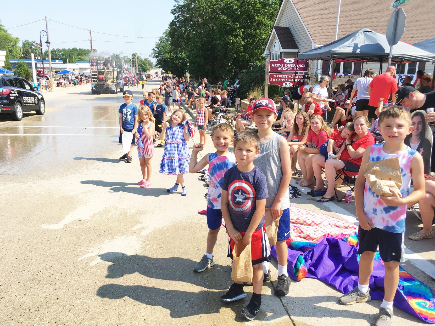 Kids line the parade route for Fourth of July celebration in Union Grove