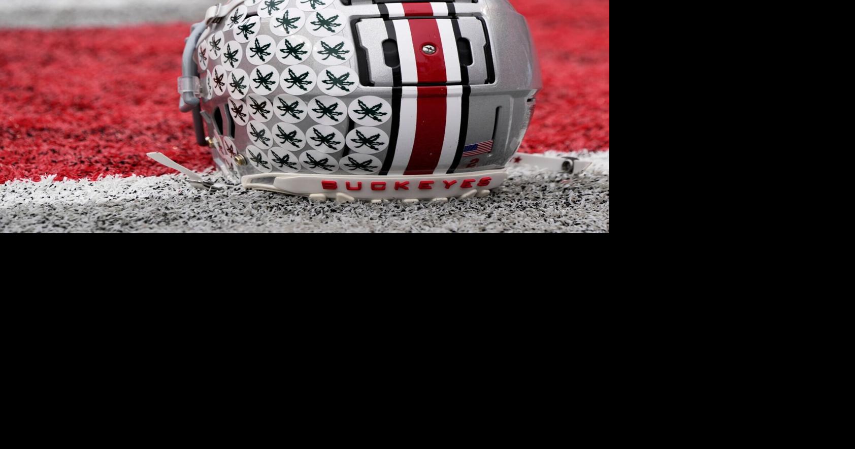 Oct. 1, 2022; Columbus, Ohio, USA; A stick-ladden Ohio State Buckeyes helmet sits on the turf during warmups before Saturday's game against the Rutgers Scarlet Knights in Columbus. Mandatory Credit: Barbara Perenic/Columbus DispatchSports Ohio State Rutg