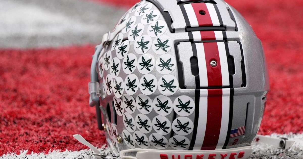Oct. 1, 2022; Columbus, Ohio, USA; A stick-ladden Ohio State Buckeyes helmet sits on the turf during warmups before Saturday's game against the Rutgers Scarlet Knights in Columbus. Mandatory Credit: Barbara Perenic/Columbus DispatchSports Ohio State Rutg