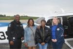 Participant Jordyn Brown is shown is shown with her team