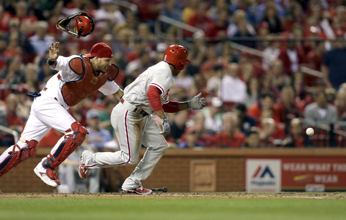 Revere hits rare homer as Phillies beat Nationals in 11