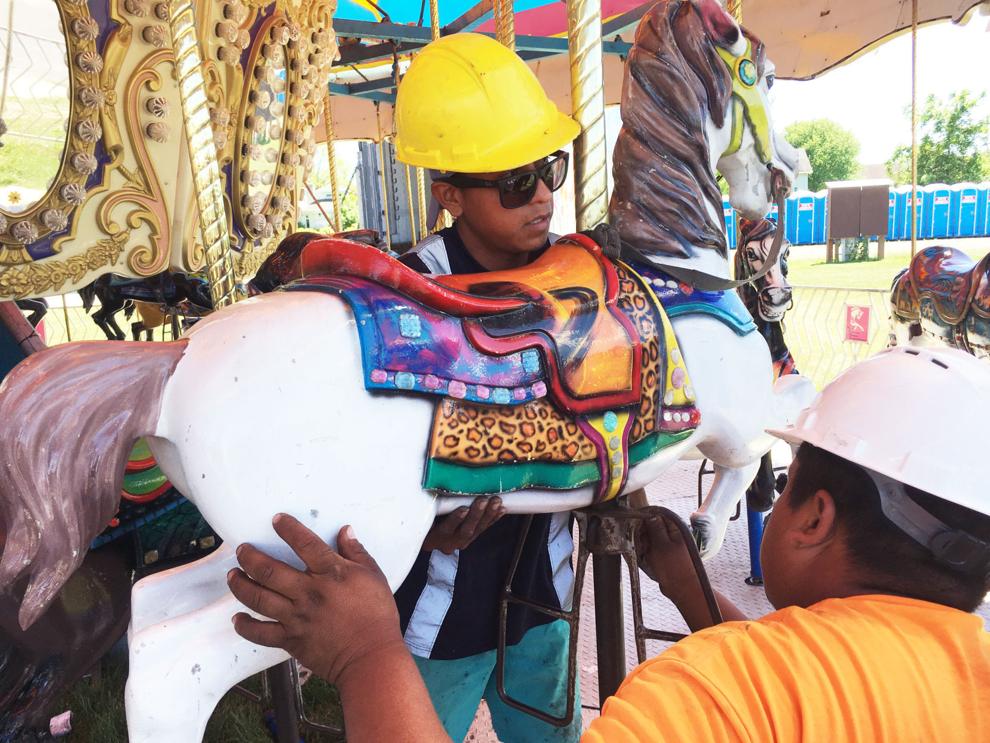Photos Carnival ride workers and others prepare the new Burlington