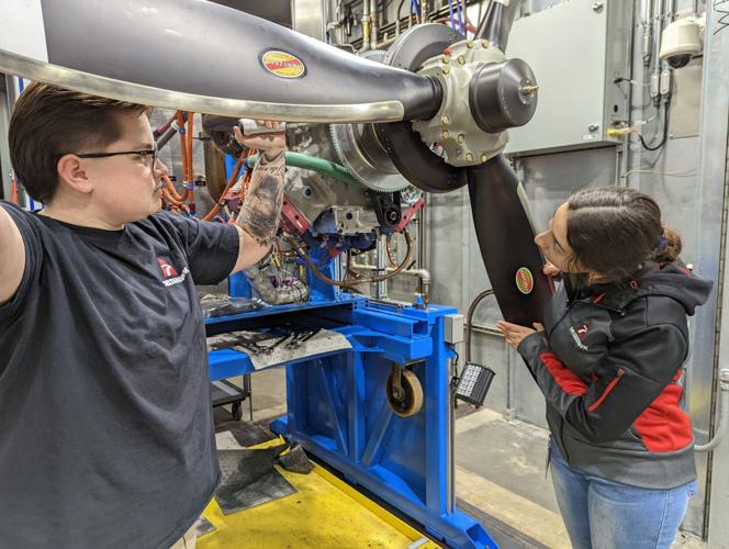 RUSD students examine a DeltaHawk propeller