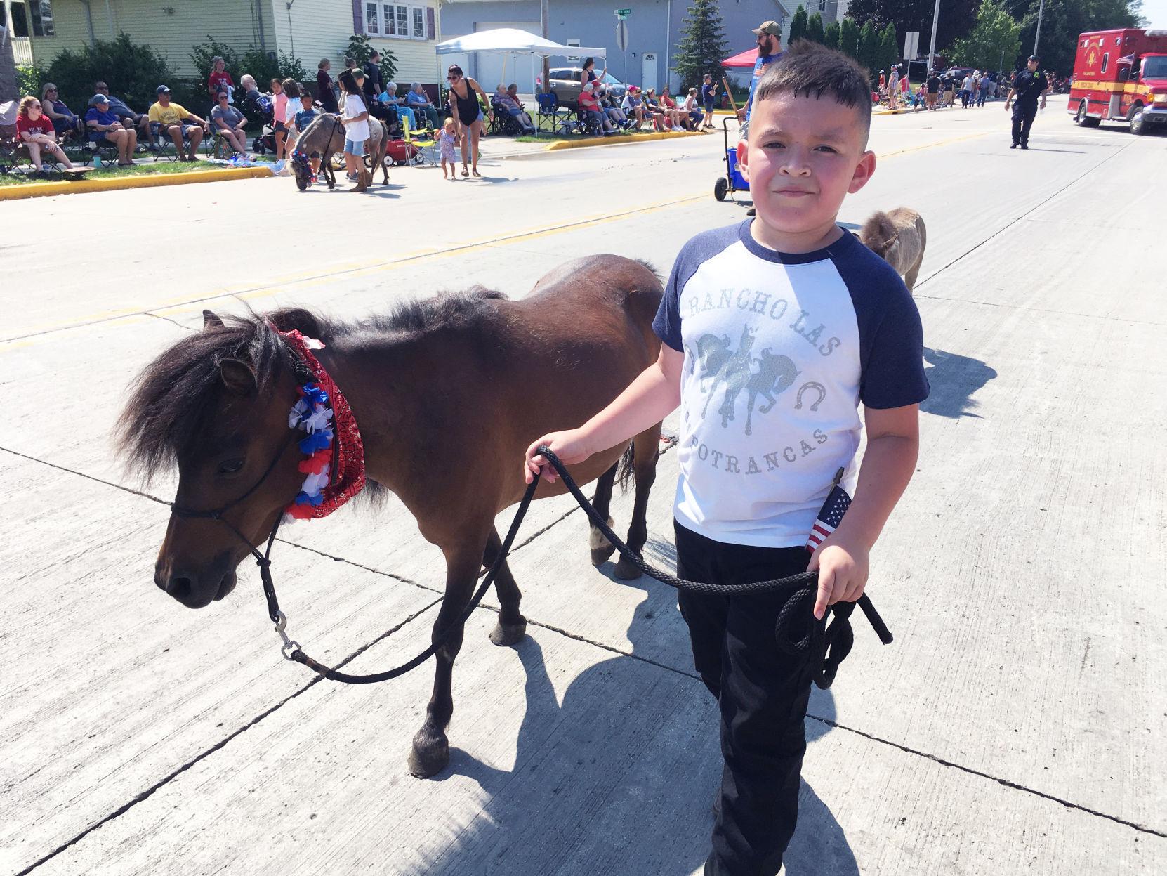 Dave DeLeon with miniature horse at Fourth of July parade in Union Grove