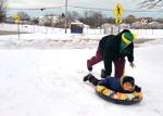 Smiling and sledding