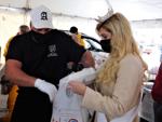 Ray Stibeck and Miss Racine bag Thanksgiving dinners