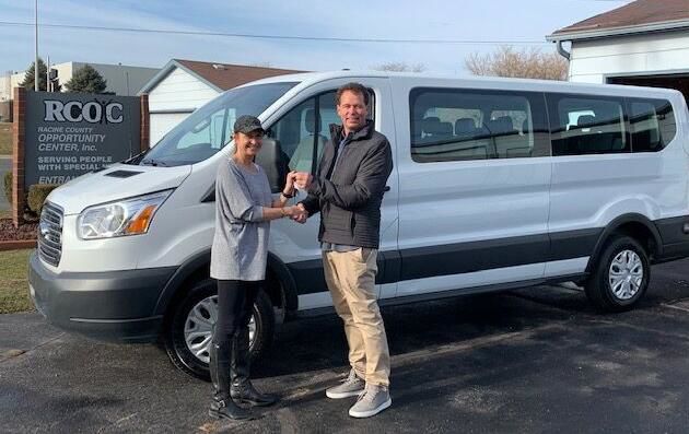 Patrick Christensen donating the van to the Hands of Opportunity Center provided by Horizon Retail Construction