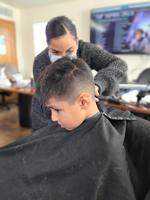 Courtney Krekling gives a haircut