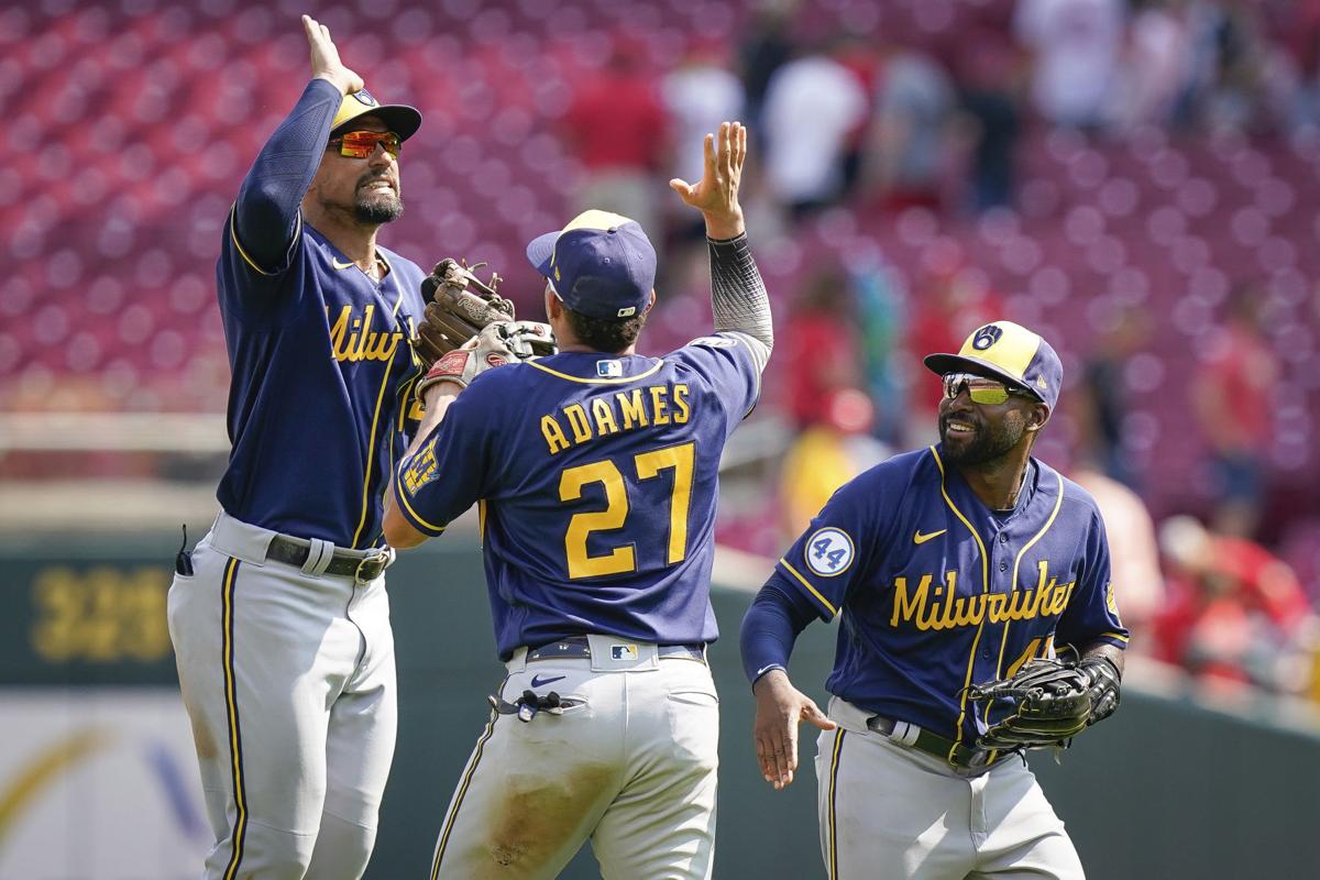 Reds beat Brewers with homer off Josh Hader in game with 3 ejections