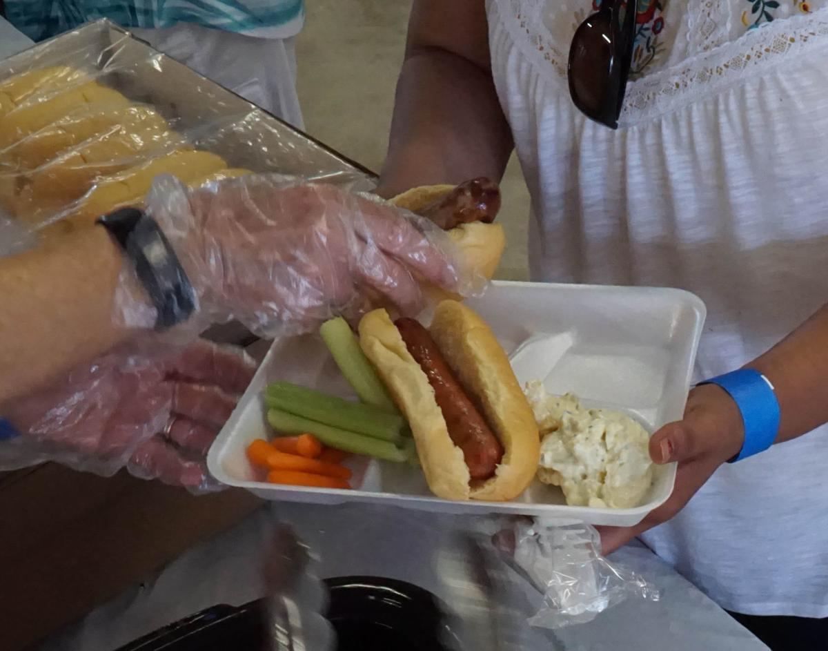 KIWANIS SERVES UP PICNIC FOOD Faith & Community