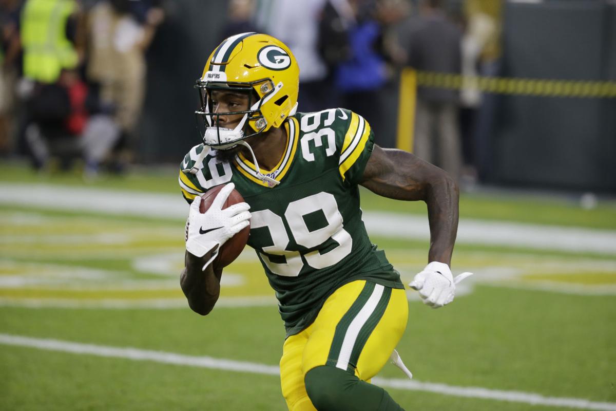 FILE - In this Dec 19. 2020, file photo, Green Bay Packers quarterback Aaron  Rodgers (12) smiles before an NFL football game against the Carolina  Panthers in Green Bay, Wis. After a