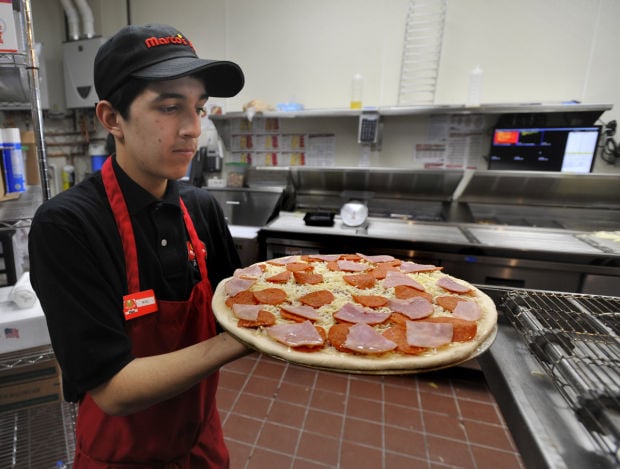 Dinner and a show: Marco's Pizza opens at Family Video | Local News | journaltimes.com