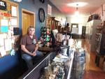 Dan Wilburth inside new location for his Rustic Barrel antique shop in Town of Burlington