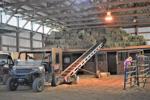 Hay bales inside the indoor arena at Twisted Ridge